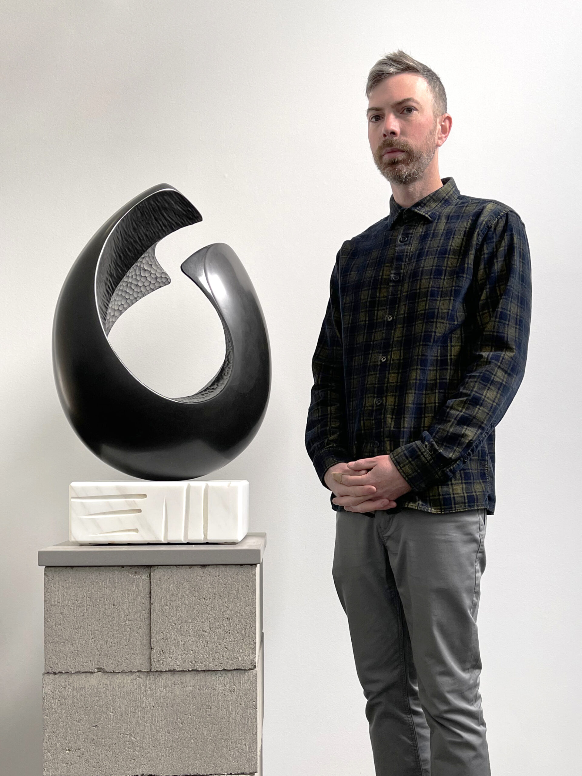 Jeremy Kester in studio with A Feeling Within sculpture