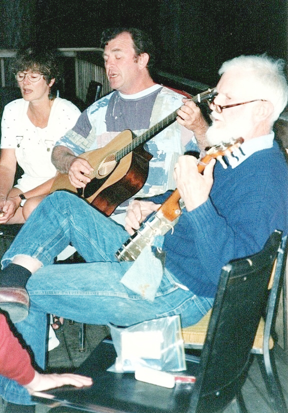 Barbara Davidson, George Pratt & David Edwards serandading at Fisher Lodge, Camp B 1992